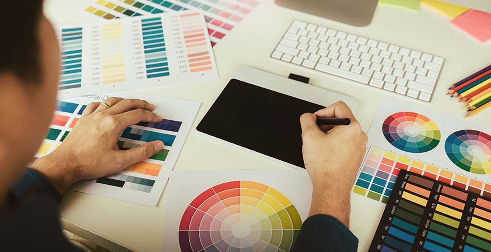 A graphic designer choosing colour palletes for branding and web design 