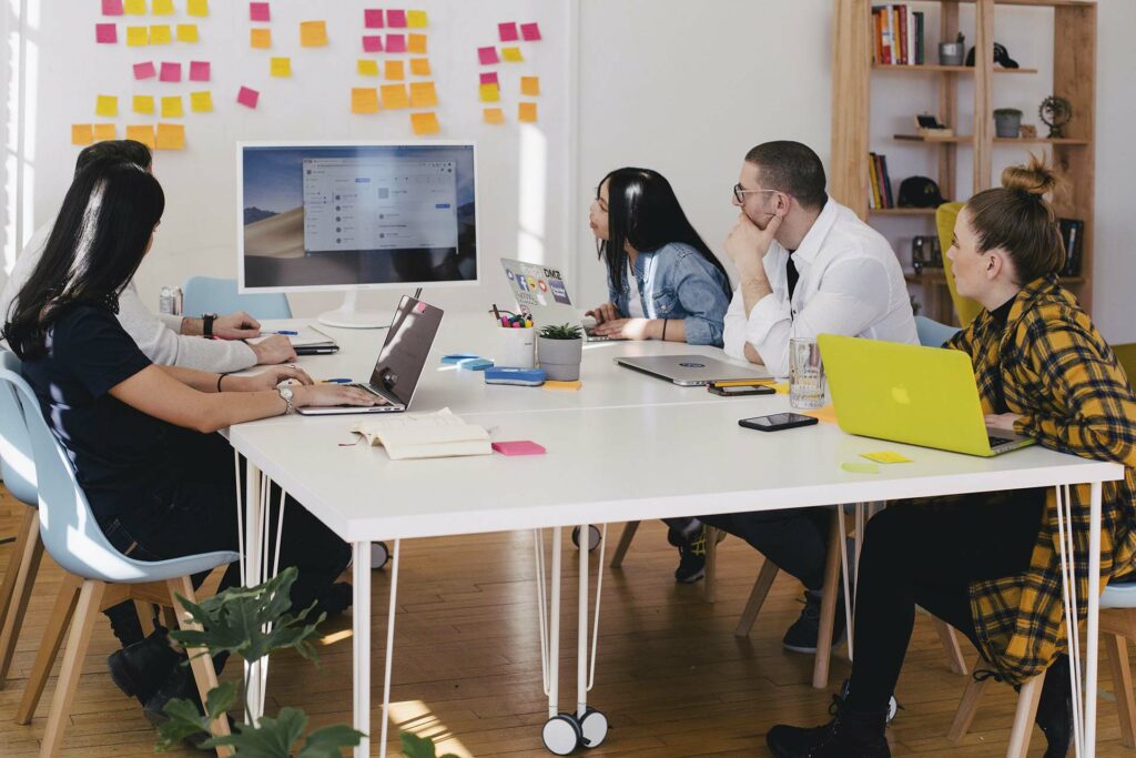 A team in a digital marketing agency holding a meeting about social media strategy